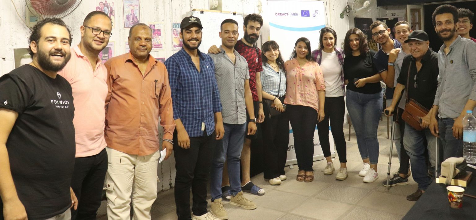 A group of programme participants photographed indoors